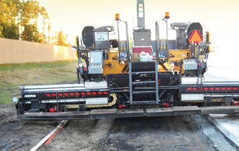 A paving screed designed for paving wider roads and surfaces uses a Gortrac SX Series carrier to guide the power cables as the slide track telescopes to the required width.