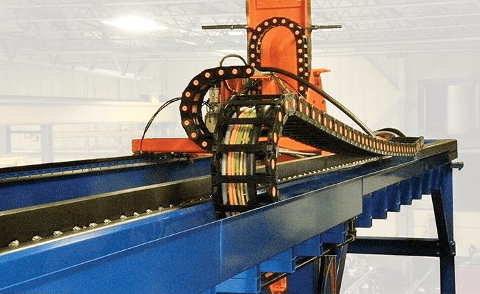 Nylatrac plastic cable carriers installed on machine.