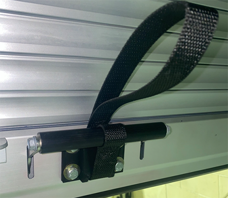 Inside handle release strap is one of the accessory options for Dynatect's roll-up doors.